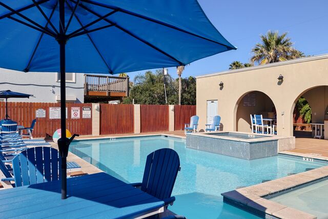 Heated pool and hot tub deck at Athena Ares Seaside Estate, South Padre Island