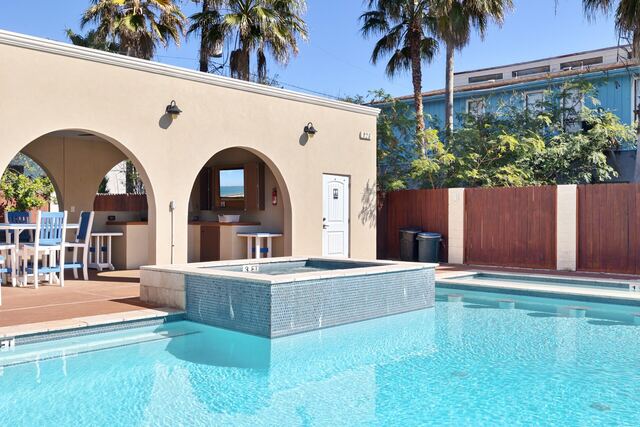 Heated pool and hot tub deck at Athena Ares Seaside Estate, South Padre Island