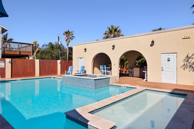 Heated pool and hot tub deck at Athena Ares Seaside Estate, South Padre Island