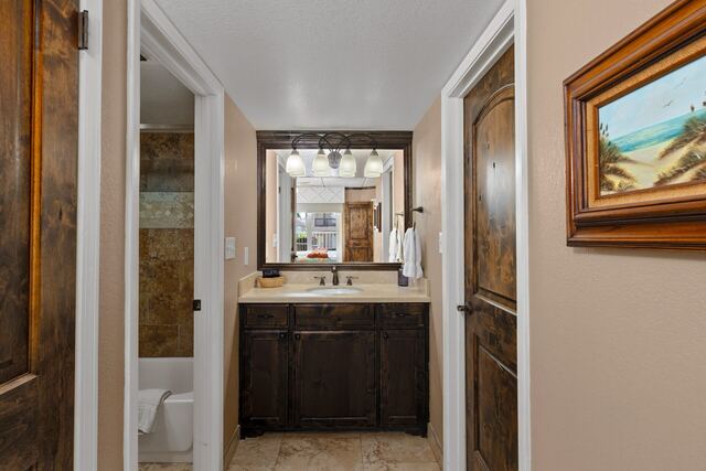 Pool deck loungers and umbrella at Athena Ares Seaside Estate, South Padre Island