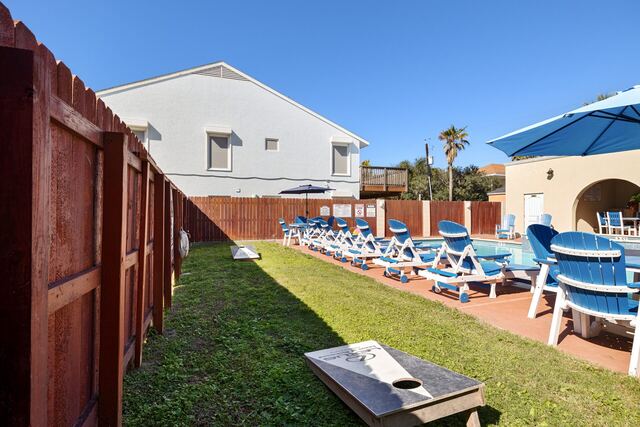 Sun deck with Adirondack chairs at Athena Ares Seaside Estate, South Padre Island