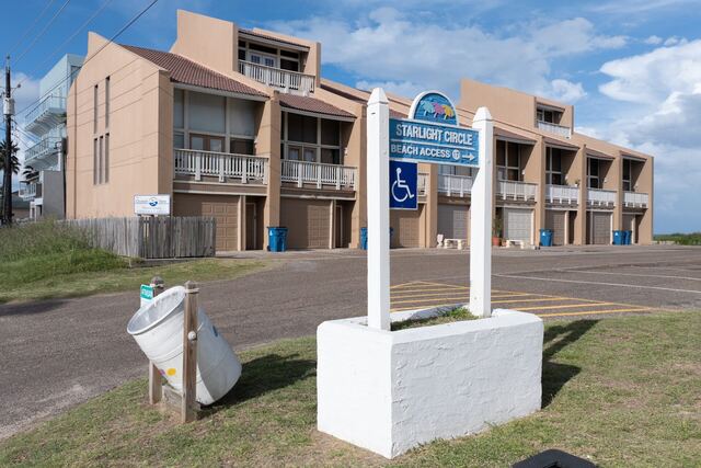 Outdoor poolside seating at Athena Ares Seaside Estate, South Padre Island